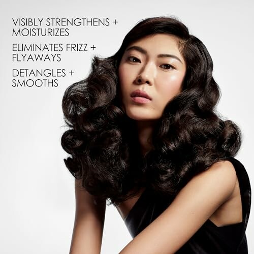 Woman with voluminous hair showcasing hair care benefits: strengthens, moisturizes, eliminates frizz, detangles.